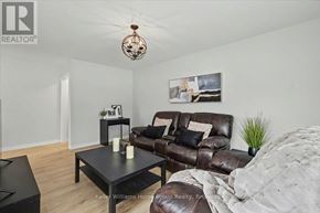 Cambridge apartment for rent - A living room with a brown leather couch and a black coffee table.