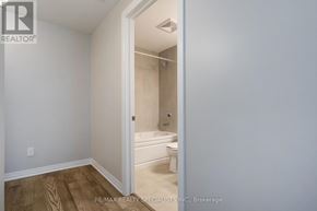 Milton (Walker) condo for rent - A white bathroom with a toilet, sink and bathtub.