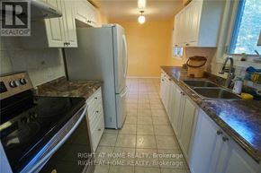 Mississauga (Creditview) apartment for rent - A kitchen with a refrigerator, oven, and sink.