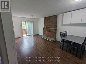 Mississauga (Creditview) apartment for rent - A room with a fireplace and a dining table.