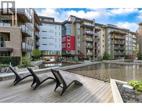 Vancouver apartment for rent - A row of modern apartment buildings with a wooden deck in front.
