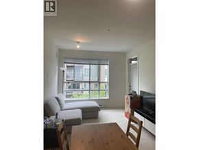 Vancouver apartment for rent - A living room with a couch, chair, and television.