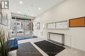 North Grenville multi-family for rent - A brokerage office with a blue bench and a white wall.