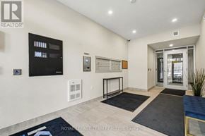 North Grenville multi-family for rent - A well-lit, spacious living room with a flat-screen TV, a whiteboard, and a glass door leading to another room.