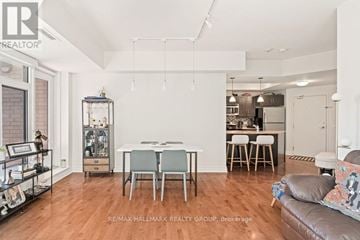 Ottawa condo for rent - A living room with a dining table and chairs.