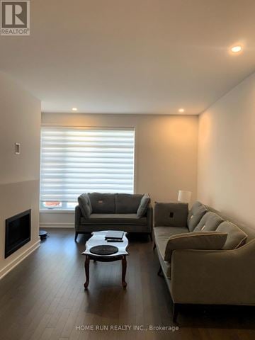 Ottawa townhouse for rent - A living room with a grey couch and a coffee table.