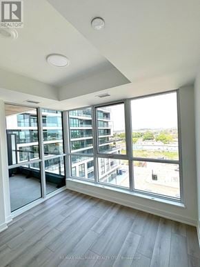 Toronto (Clairlea-Birchmount) condo for rent - A room with a large window overlooking a cityscape.