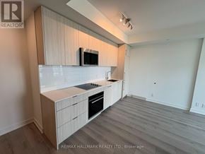 Toronto (Clairlea-Birchmount) condo for rent - A kitchen with a microwave on the counter.