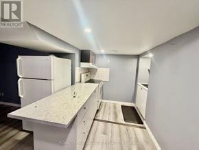 Pickering (Brock Ridge) apartment for rent - A kitchen with white appliances and a white countertop.