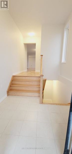 Woodstock (Woodstock - North) apartment for rent - A room with a staircase leading to a doorway.