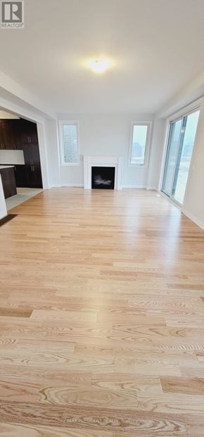 Woodstock (Woodstock - North) apartment for rent - A spacious room with wooden flooring and a fireplace.