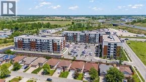 Windsor condo for rent - A bird's eye view of a residential area with apartment buildings and houses.