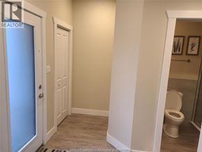Windsor townhouse for rent - A bathroom with a toilet and a door.