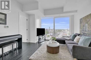 Ottawa condo for rent - A living room with a pool table and a view of the city.