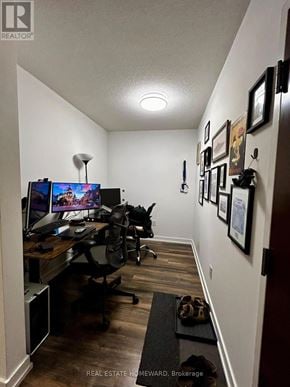 Toronto (Waterfront Communities) condo for rent - A room with a desk and chairs with a computer on it.