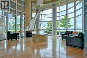 Windsor condo for rent - A realtor office with a large glass window and a curved glass sculpture.