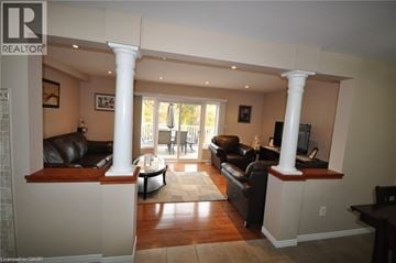Kitchener townhouse for rent - A living room with a black couch and a television.