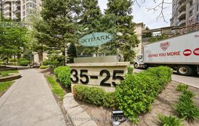 Mississauga (Hurontario) condo for rent - A sign for SkyMark is displayed in front of a building.