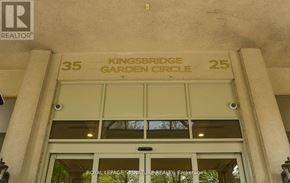 Mississauga (Hurontario) condo for rent - The entrance to a building with a glass door and a sign above it that reads "Kingsbridge Garden Circle".