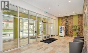 Waterloo condo for rent - The image shows a modern office lobby with a glass wall and a reception desk.