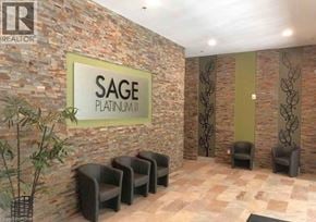 Waterloo condo for rent - A waiting area with chairs and a sign that says SAGE Platinum.