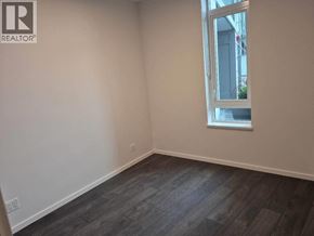 Richmond apartment for rent - A room with a window and wooden flooring.