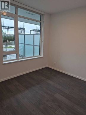Richmond apartment for rent - A room with a window and a wooden floor.