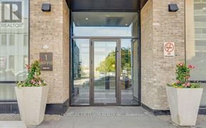 Hamilton (Beasley) condo for rent - The front of a building with a glass door and a no smoking sign.