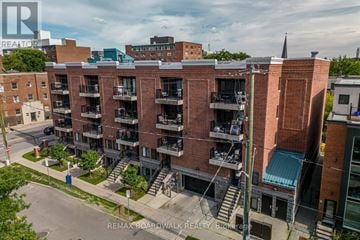 Ottawa condo for rent - A building with a balcony and a green roof is shown.