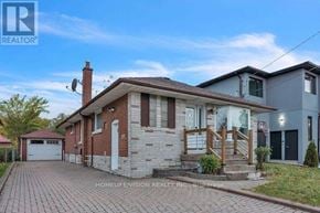 Toronto (Wexford-Maryvale) apartment for rent - A brick house with a garage is for sale.