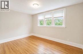 Windsor apartment for rent - A room with a window and wooden flooring.