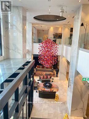 Toronto (Islington-City Centre West) condo for rent - A large floral arrangement in the center of a spacious lobby.