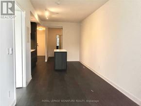 Toronto (Waterfront Communities) condo for rent - A room with a white wall and a black box on the floor.