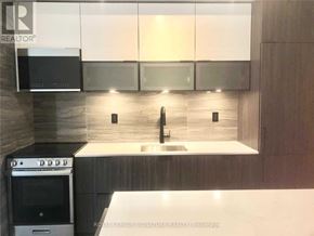 Toronto (Waterfront Communities) condo for rent - A modern kitchen with a stainless steel oven and a sink.