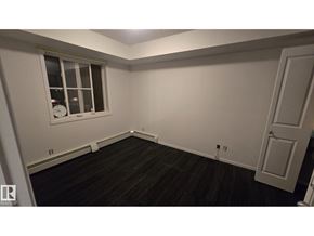 Edmonton apartment for rent - A room with a window and a door.