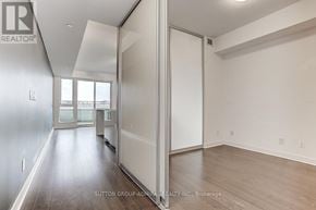 Toronto (Waterfront Communities) condo for rent - A room with a sliding door and a window.