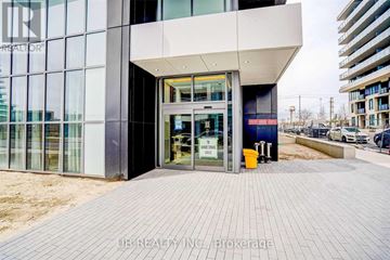 Toronto (Mimico) condo for rent - The entrance to a building with a glass door and a sign that reads "To Rent".