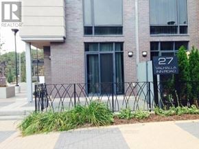 Toronto (Islington-City Centre West) townhouse for rent - A building with a sign that says 27 on it.