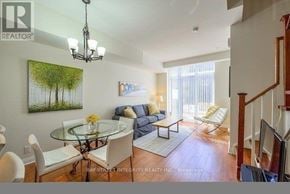 Toronto (Islington-City Centre West) townhouse for rent - A living room with a glass table and a painting of a tree on the wall.