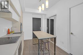 Toronto (Mount Pleasant West) condo for rent - A kitchen with a table and chairs in the middle of the room.