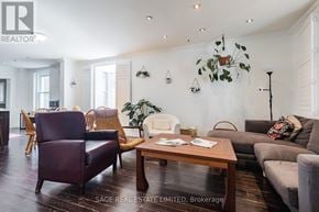 Toronto (Greenwood-Coxwell) apartment for rent - A living room with a brown leather chair and a wooden coffee table.