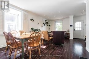 Toronto (Greenwood-Coxwell) apartment for rent - A dining room with a table and chairs.