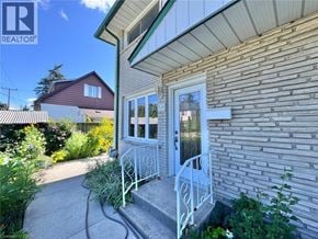 Cambridge townhouse for rent - A house with a white door and a small porch.