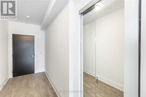 Toronto (Mount Pleasant West) condo for rent - A room with a black door and a sliding glass door.