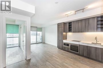 Toronto (Mount Pleasant West) condo for rent - A modern kitchen with wooden cabinets and a large island.