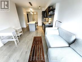 Toronto (Church-Yonge Corridor) condo for rent - A living room with a white couch and a wooden floor.