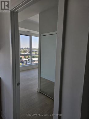 Toronto (Clairlea-Birchmount) condo for rent - A glass door leads to a balcony with a view of the city.