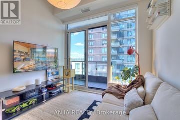 Richmond Hill (South Richvale) condo for rent - A living room with a white couch and a large window with a view of a building.
