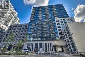 Richmond Hill (South Richvale) condo for rent - A tall building with blue and white balconies stands in front of other buildings.