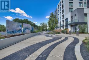 Richmond Hill (South Richvale) condo for rent - A real estate photo of a building with a blue sky in the background.